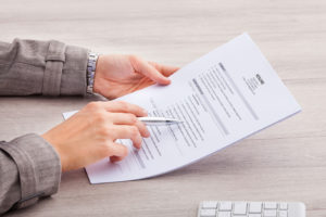 close up of man holding resume