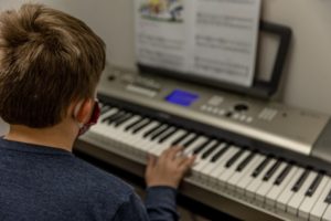 Boy playing the piano - St. Cloud Music Academy