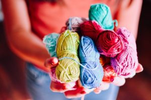 Girl holding colored yarn - Yuli’s Happy Shop
